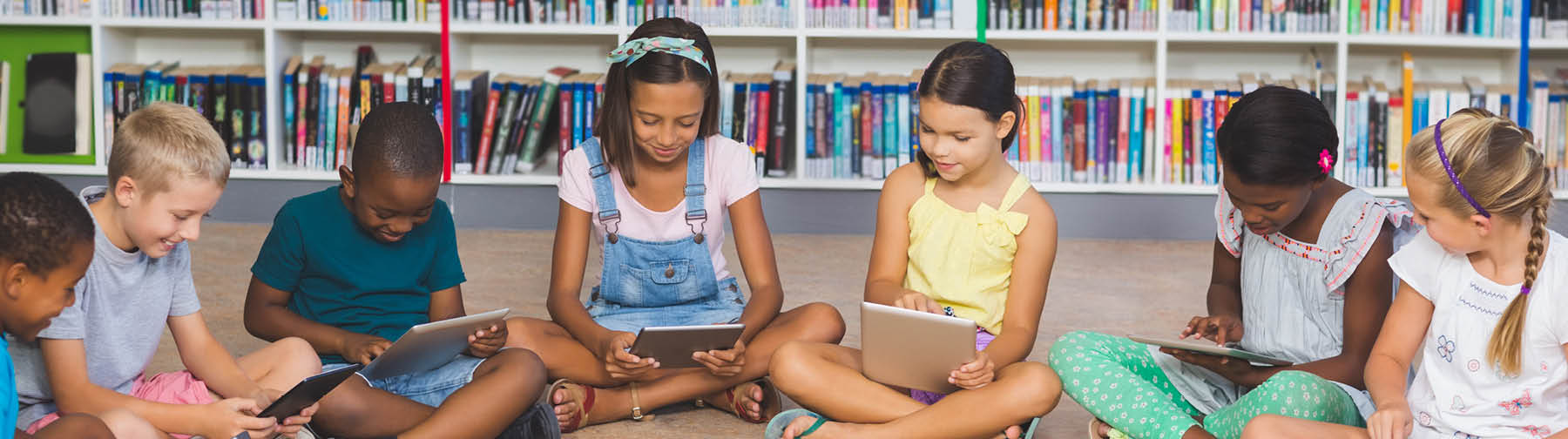 students learning using tablets