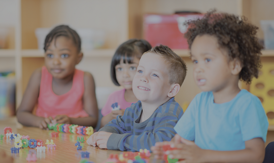 kids sitting at a classroom table