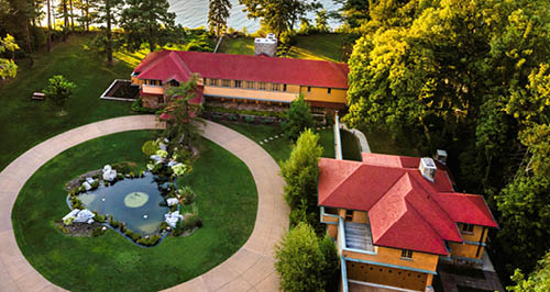 Overhead image of the Graycliff, a yellow prick building with a bright red roof