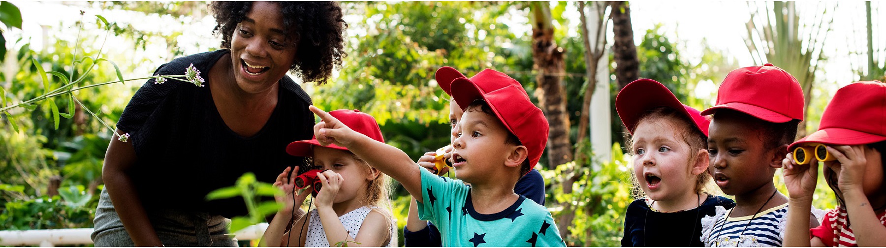 children exploring on a field trip with their teacher