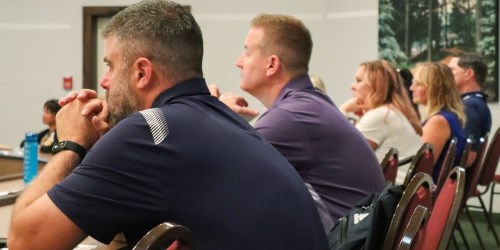 two male teachers attending a professional development course