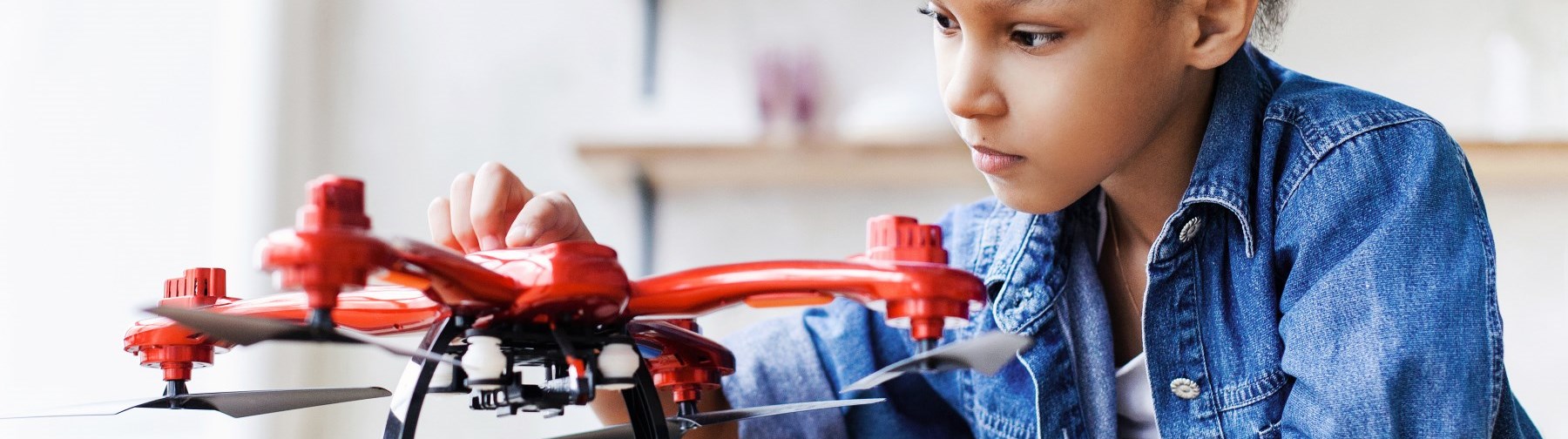 student learning how to use a drone